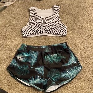 Striped bikini top and swim shorts with leaves